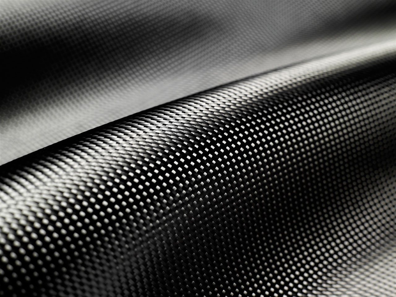 La fibre de carbone requiert une épaisseur de matériau moindre que la fibre tricomposite ou l'injecté